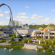 The Jurassic Park and Jurassic World franchise area with the Velocicoaster rollercoaster in view